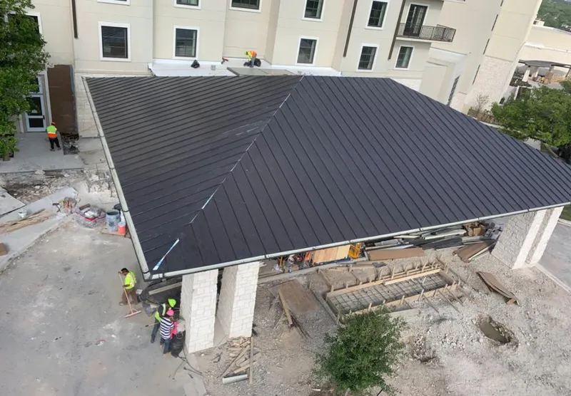 Metal roofing installation team working on a commercial building in York